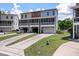 Three-story townhome offers attached garages and private screened porches for relaxed outdoor living at 1589 Bluewater Way, Charleston, SC 29414