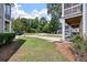 Green lawn area and a well-maintained landscape, with a partial view of the building and greenery at 1589 Bluewater Way, Charleston, SC 29414