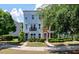 View of townhomes with manicured landscaping and a sidewalk leading to the entryways at 1589 Bluewater Way, Charleston, SC 29414