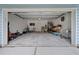 Open garage featuring kayaks, storage shelves, and ample room for parking vehicles at 1589 Bluewater Way, Charleston, SC 29414