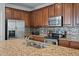 Modern kitchen featuring stainless steel appliances and granite countertops at 1589 Bluewater Way, Charleston, SC 29414