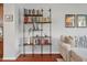 Close up view of a stylish bookshelf, decor, and comfortable seating at 1589 Bluewater Way, Charleston, SC 29414