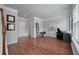 Bright living room with hardwood floors, a work area, and neutral wall colors at 1589 Bluewater Way, Charleston, SC 29414