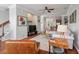 Inviting living room with hardwood floors, ceiling fan, and stylish furnishings and view to kitchen at 1589 Bluewater Way, Charleston, SC 29414