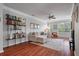 Cozy living room with hardwood floors, bookshelf and comfortable seating arrangement at 1589 Bluewater Way, Charleston, SC 29414