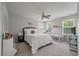 Spacious main bedroom with ceiling fan, large bed, and a crib near the window at 1589 Bluewater Way, Charleston, SC 29414