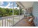 Relaxing screened porch with wood flooring and beautiful views of nature at 1589 Bluewater Way, Charleston, SC 29414