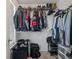 Walk-in closet provides ample storage space for clothes, shoes, and luggage on shelves and racks at 1589 Bluewater Way, Charleston, SC 29414