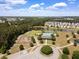 An aerial view of the community highlights a swimming pool, playground, clubhouse and ponds, creating a vibrant neighborhood at 167 Decatur Dr, Summerville, SC 29486