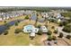 An aerial view showcasing a community pool, clubhouse, playground, and scenic ponds, offering a variety of amenities at 167 Decatur Dr, Summerville, SC 29486