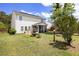 The home features a lovely backyard with a fountain and screened porch, perfect for outdoor relaxation and entertainment at 167 Decatur Dr, Summerville, SC 29486