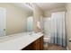 Classic bathroom features wood vanity, white sink, large mirror, shower-tub combo and neutral walls at 167 Decatur Dr, Summerville, SC 29486