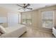 Sunny bedroom features a ceiling fan, two windows, and a large closet for storage at 167 Decatur Dr, Summerville, SC 29486