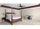 Spacious bedroom features a four-poster bed, ceiling fan, and decorative trim around the tray ceiling at 167 Decatur Dr, Summerville, SC 29486