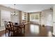 Bright dining room with wood floors, chandelier, a wooden table and shelves at 167 Decatur Dr, Summerville, SC 29486