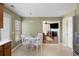 Bright kitchen with wood cabinets, tiled floor, breakfast nook and view into the living room at 167 Decatur Dr, Summerville, SC 29486
