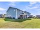 Expansive backyard featuring a screened porch, well-maintained lawn, and fenced yard for outdoor enjoyment at 185 Whaler Ave, Summerville, SC 29486