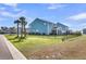 Spacious backyard with black fence, palm trees, and well-maintained lawn at 185 Whaler Ave, Summerville, SC 29486