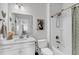 Bright bathroom with a shower-tub combo, framed mirror, and white cabinetry at 185 Whaler Ave, Summerville, SC 29486