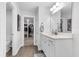 Bright bathroom featuring a white vanity, neutral walls, wood-look floors, and a closet at 185 Whaler Ave, Summerville, SC 29486