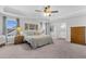 Comfortable bedroom featuring tray ceilings, neutral decor, natural light, and carpet floors at 185 Whaler Ave, Summerville, SC 29486