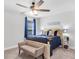 Bright bedroom featuring a window with blue curtains and a full-sized bed at 185 Whaler Ave, Summerville, SC 29486
