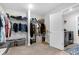 Organized walk-in closet with built-in shelving and hanging rods, next to a laundry room with gray washer and dryer at 185 Whaler Ave, Summerville, SC 29486