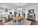 Open-concept dining room with adjacent kitchen and living area perfect for entertaining guests at 185 Whaler Ave, Summerville, SC 29486