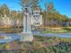 West Lake community entrance sign with manicured landscaping and a scenic road leading into the neighborhood at 185 Whaler Ave, Summerville, SC 29486