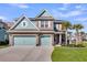 Charming brick home with a two-car garage, palm trees, and well-manicured lawn at 185 Whaler Ave, Summerville, SC 29486