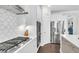 Elegant kitchen featuring stainless steel appliances, gas range, and stylish white cabinetry at 185 Whaler Ave, Summerville, SC 29486