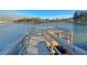 Up close lake pier with sturdy wooden railings and a peaceful view at 185 Whaler Ave, Summerville, SC 29486