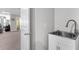 Laundry area features a stainless steel sink with a white cabinet beneath at 185 Whaler Ave, Summerville, SC 29486
