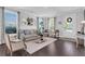Cozy living room featuring hardwood floors, neutral furnishings, and ample natural light at 185 Whaler Ave, Summerville, SC 29486