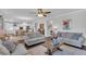 Inviting living room featuring hardwood floors, an open layout to the kitchen, and neutral decor at 185 Whaler Ave, Summerville, SC 29486