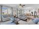Bright living room with large windows, hardwood floors, and an open layout to the kitchen at 185 Whaler Ave, Summerville, SC 29486