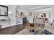 Bright living room with dark hardwood floors, staircase and view to dining area at 185 Whaler Ave, Summerville, SC 29486