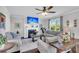 Cozy living room with a fireplace, ceiling fan, and multiple couches for comfortable seating at 185 Whaler Ave, Summerville, SC 29486