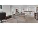 Open living room features a sofa, carpeted floor, and white walls at 185 Whaler Ave, Summerville, SC 29486