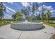 Community water feature with circular fountain in green space at 185 Whaler Ave, Summerville, SC 29486