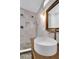 Modern bathroom with white marble tile, dual shower heads and a vessel sink at 1920 Iris St, North Charleston, SC 29405