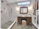 Bright bathroom featuring a dual shower head, vessel sink and custom vanity at 1920 Iris St, North Charleston, SC 29405