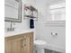 Bright bathroom with a wood vanity and modern fixtures at 1920 Iris St, North Charleston, SC 29405