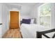 Bright bedroom with a twin bed and closet at 1920 Iris St, North Charleston, SC 29405
