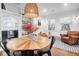 Cozy dining area with a round wooden table and modern light fixture at 1920 Iris St, North Charleston, SC 29405