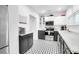 Spacious kitchen featuring black cabinets, stainless steel appliances, and decorative tile floors at 1920 Iris St, North Charleston, SC 29405