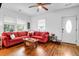 Bright living room with hardwood floors, a ceiling fan, and natural light at 1920 Iris St, North Charleston, SC 29405