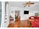 Open living area with hardwood floors, an adjacent dining space, and natural light at 1920 Iris St, North Charleston, SC 29405