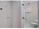 Bathroom featuring light gray walls with plumbing for washer and dryer along with a white framed shower at 1986 Elaine St, Johns Island, SC 29455