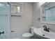 This bathroom features a glass shower with matte black hardware, toilet, and sink with a framed mirror at 1986 Elaine St, Johns Island, SC 29455